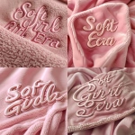 **ultra-realistic typography logo that reads "Soft Girl Era", in a graceful hand-lettered cursive script, delicate yet bold, with smooth rounded strokes, made of plush suede fabric, subtle stitching detail, resting on a soft-focus powder-pink suede background, natural diffused studio lighting, high-resolution macro texture, creamy pastel tones, dreamy feminine aesthetic, no symbols, no frames, just the elegant suede text on suede backdrop --ar 1:1 --v 6.0 --s 250 --raw** - <@1070056867990085722> (fast)