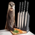 **<https://s.mj.run/QKRtVy2rcpE> ultra realistic happy otter in a cozy modern kitchen, standing at the counter cutting vegetables, cheerful lifelike expression, beside a modern stainless steel knife block with shiny knives, product photography style, bright natural lighting, warm friendly atmosphere, subtle background hint of a geomagnetic storm --ar 16:9 --q 2** - Image #2 <@1406273850403983380>