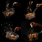**a black person's hand holding the handle of a fish frier basket tossing freshly fried fish in the air from the fryer basket. Against a black background. --v 7.0** - <@817880507983069194> (fast)