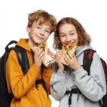**two students, boy and girl with backpacks, happily eating kebab wraps, photo, white background** - Image #2 <@1019171884983648307>